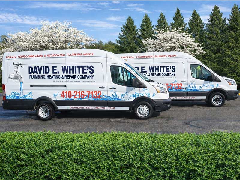 2 work trucks from David E. White's Plumbing, Heating, & Repair Company.